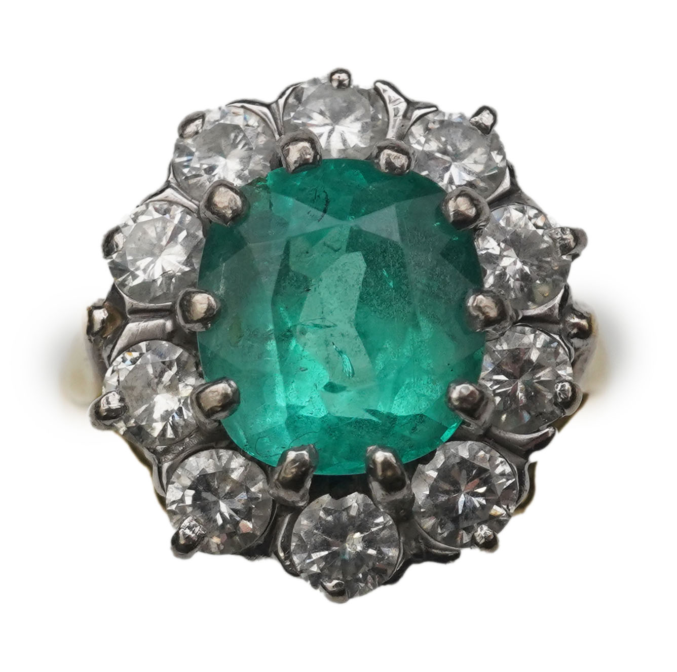 An emerald and diamond ring